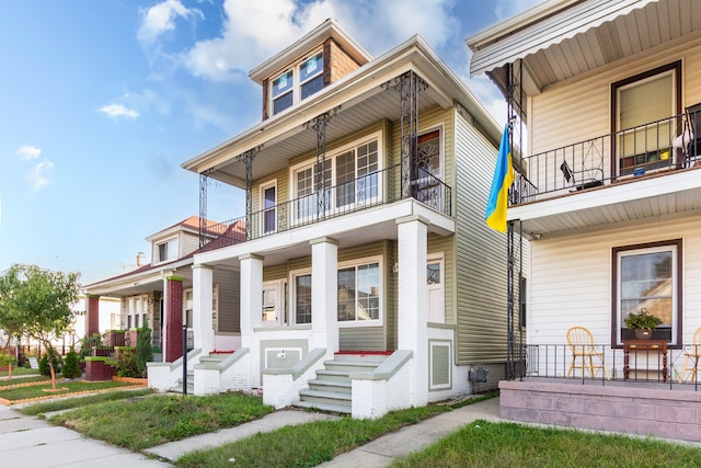 view of front facade featuring a porch and a balcony