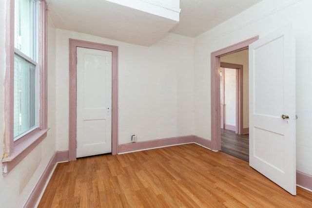 unfurnished room featuring light wood-type flooring