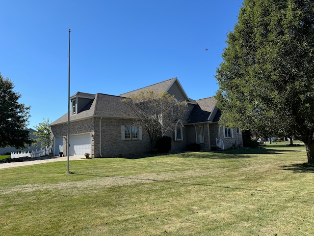 view of front facade with a front yard and a garage