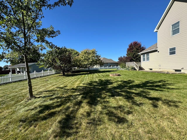 view of yard featuring a wooden deck