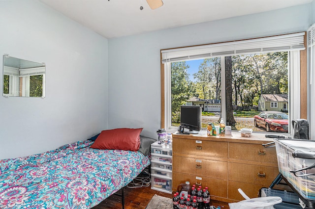 bedroom with ceiling fan and dark wood-type flooring