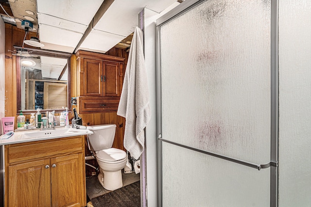 bathroom featuring vanity and a shower with door