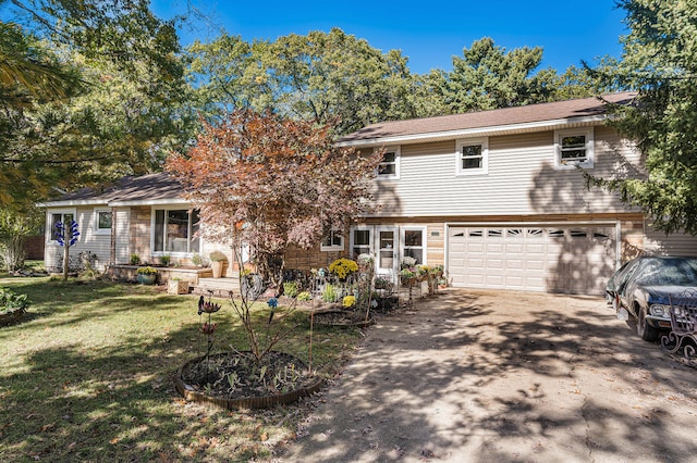 view of front of property featuring a garage and a front lawn