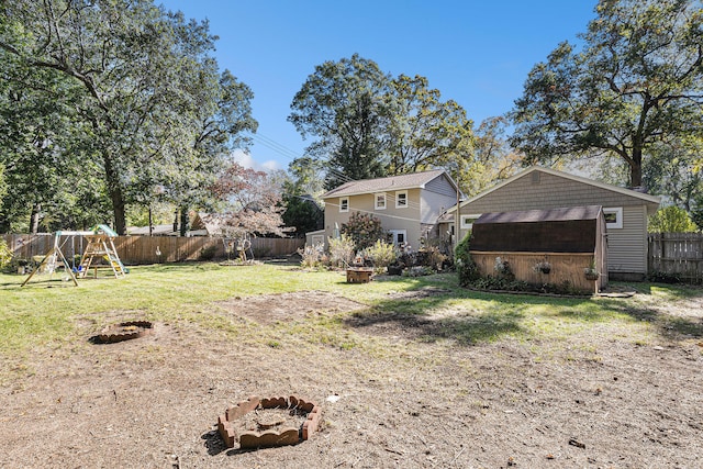 view of yard with a playground and a shed