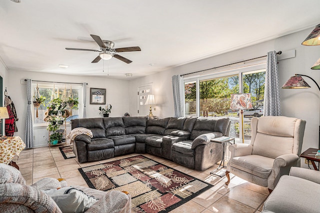 tiled living room with ceiling fan