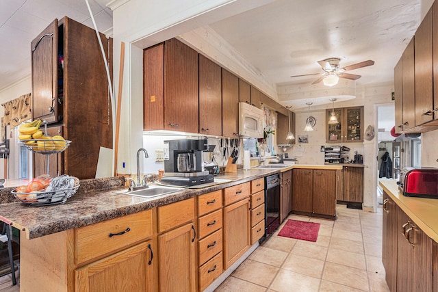 kitchen with kitchen peninsula, ceiling fan, sink, and black dishwasher