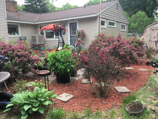 view of front of property with a storage unit