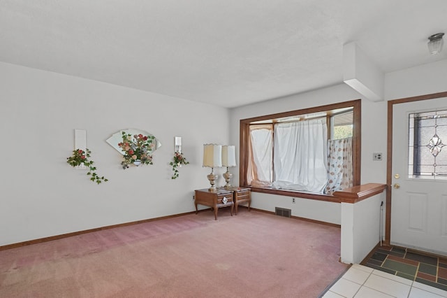 entryway featuring light carpet