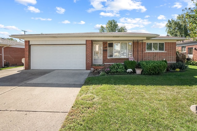 single story home featuring a garage and a front lawn