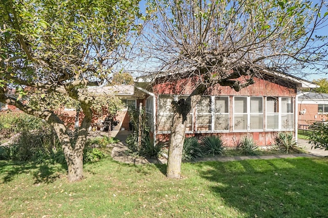 exterior space with a front yard