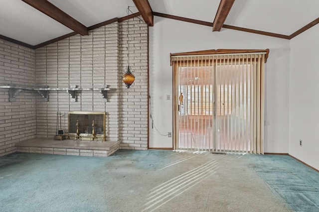 unfurnished living room featuring a brick fireplace, lofted ceiling with beams, brick wall, and carpet flooring