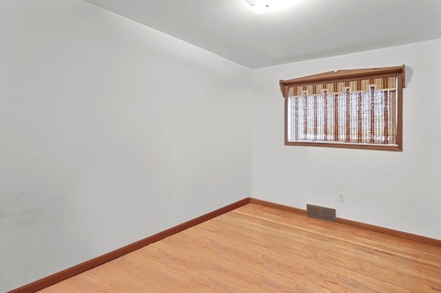 empty room with wood-type flooring