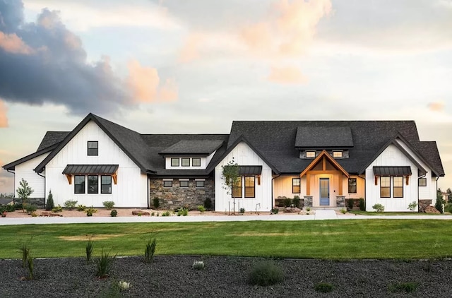 view of front of property with a lawn