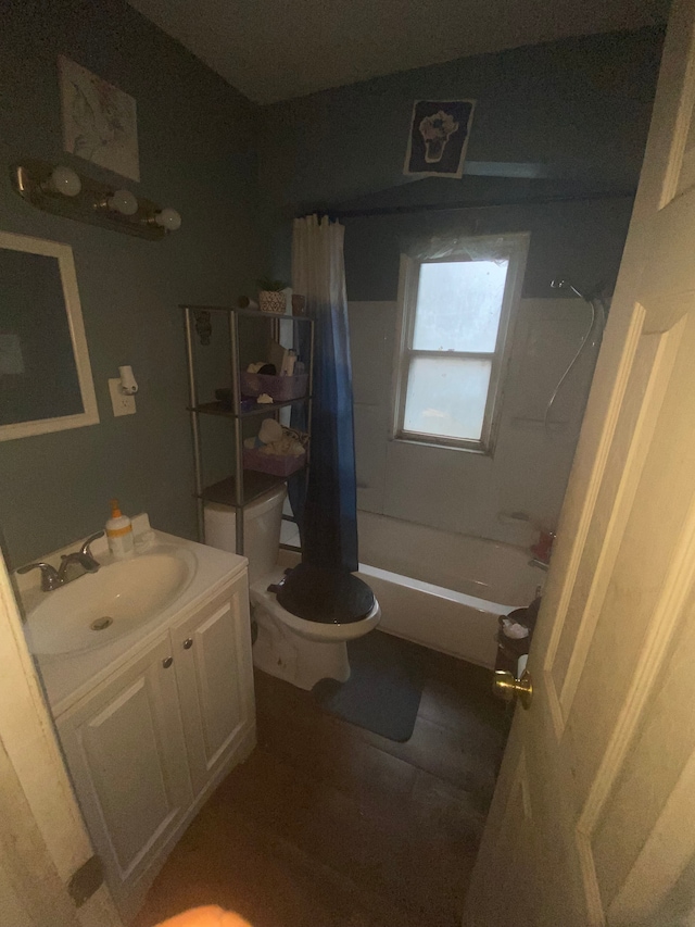 full bathroom featuring hardwood / wood-style floors, vanity, shower / bath combination with curtain, and toilet