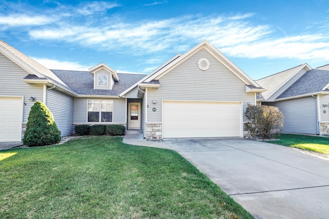 view of front of house with a front yard and a garage