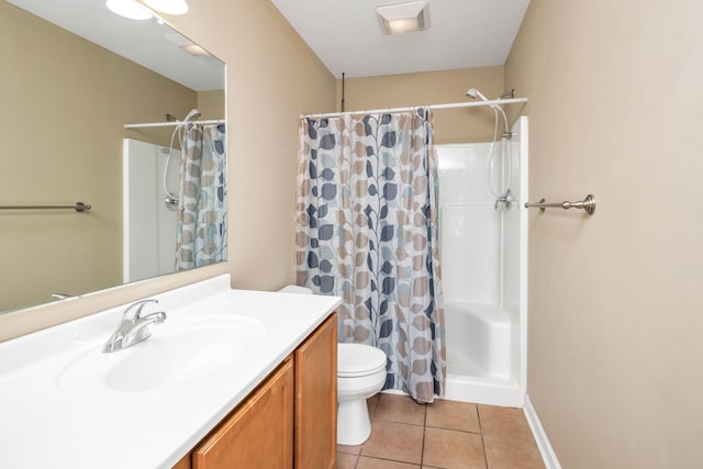 bathroom with tile patterned flooring, a shower with curtain, vanity, and toilet