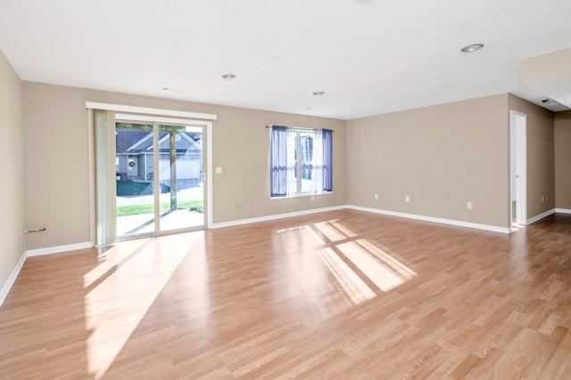 empty room with light hardwood / wood-style floors