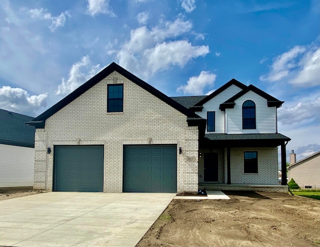 view of front facade featuring a porch and a garage