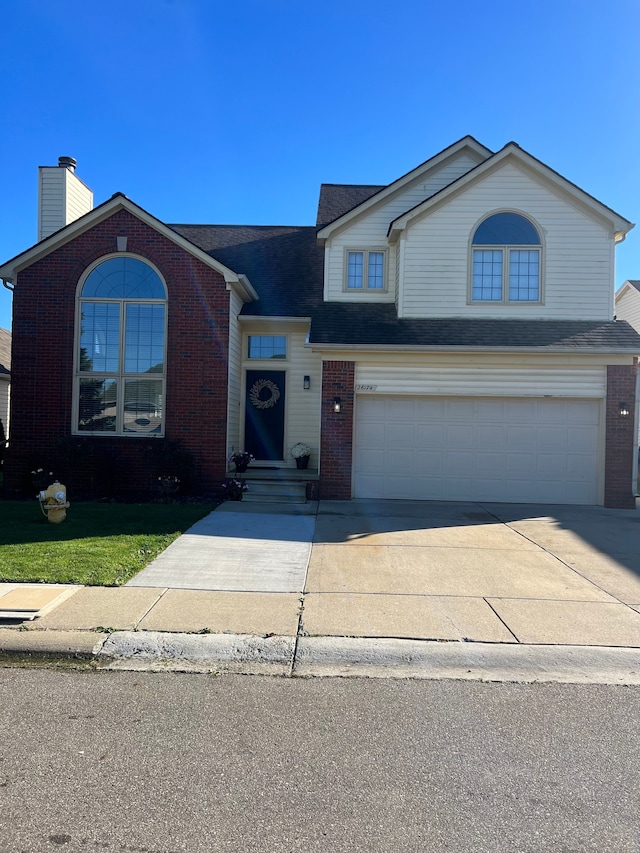 view of front of property with a garage