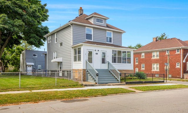 view of front of home featuring a front yard