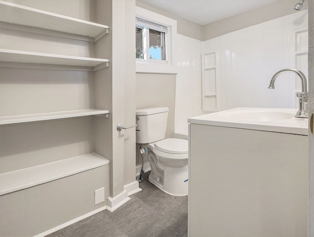 bathroom featuring toilet and sink