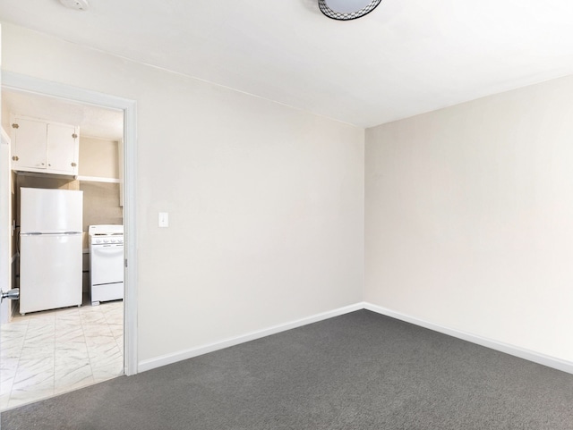 unfurnished room with light carpet