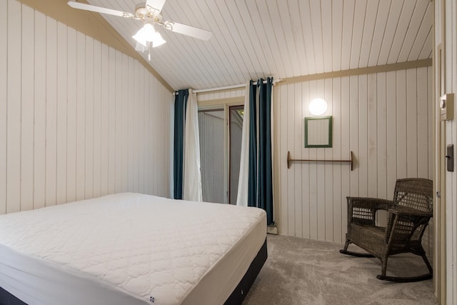 carpeted bedroom featuring ceiling fan, wood walls, lofted ceiling, and wooden ceiling