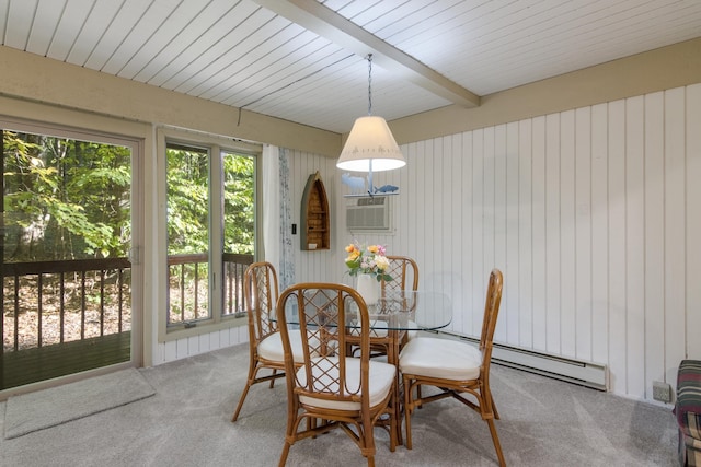 carpeted dining room featuring beam ceiling, a baseboard radiator, and a wall mounted air conditioner