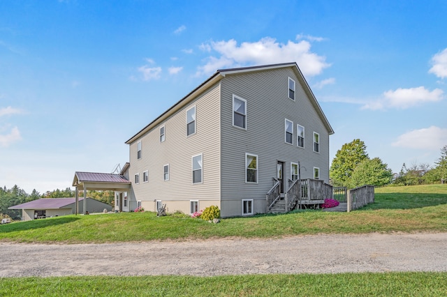 view of side of home featuring a yard