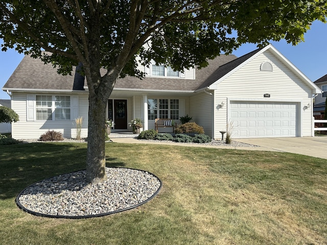 view of front of home featuring a front yard, a porch, and a garage