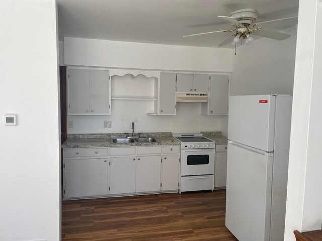 kitchen featuring ceiling fan, white appliances, sink, and dark wood-type flooring