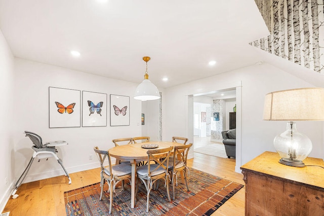 dining area with hardwood / wood-style flooring