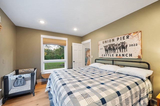 bedroom with light hardwood / wood-style floors