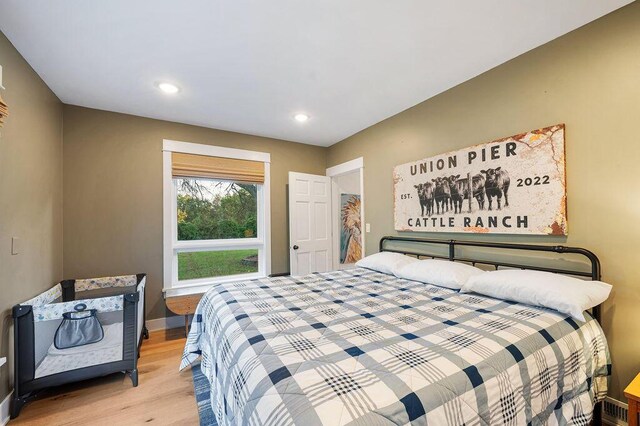 9695 Community Hall Rd, Union Pier, MI 49129 - bedroom featuring wood finished floors, baseboards, and recessed lighting