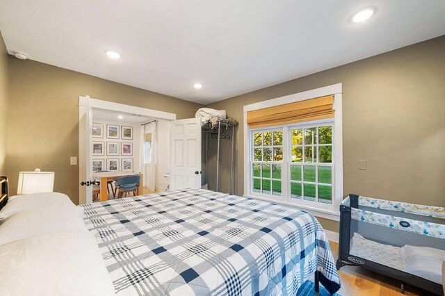 9695 Community Hall Rd, Union Pier, MI 49129 - bedroom with recessed lighting, wood finished floors, and baseboards