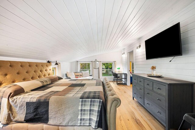 9695 Community Hall Rd, Union Pier, MI 49129 - bedroom with vaulted ceiling, wood ceiling, light wood-type flooring, and wooden walls