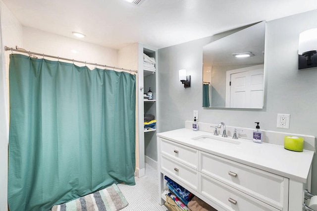 bathroom featuring tile patterned floors, vanity, and a shower with shower curtain