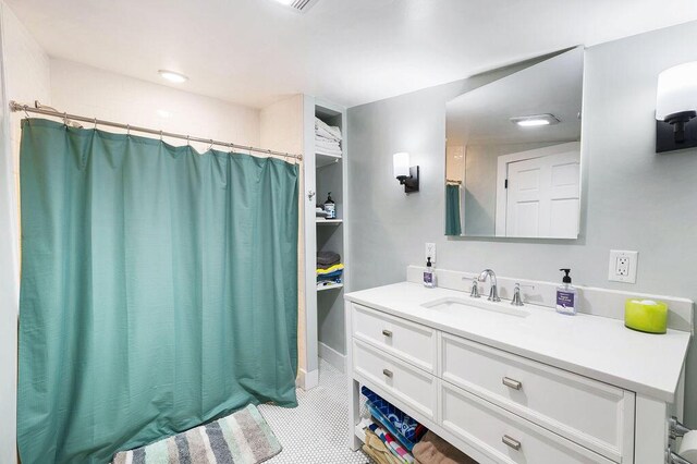 9695 Community Hall Rd, Union Pier, MI 49129 - full bathroom featuring vanity, a shower with shower curtain, and tile patterned flooring