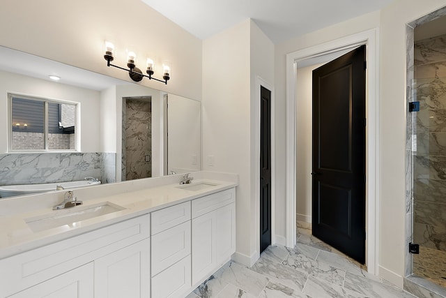 bathroom featuring shower with separate bathtub and vanity