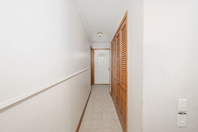 hallway featuring ornamental molding