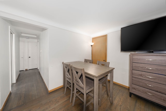 dining space featuring dark hardwood / wood-style floors