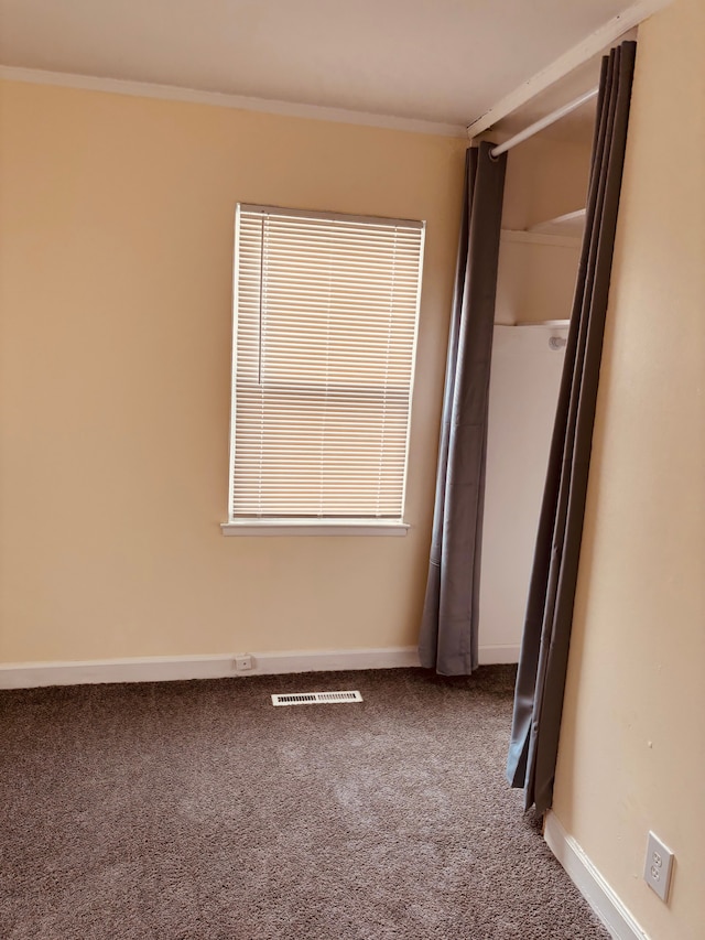 unfurnished bedroom featuring carpet floors and ornamental molding