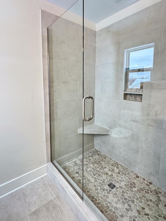 bathroom featuring tile patterned flooring and walk in shower