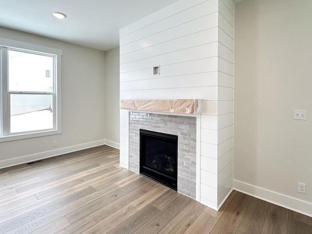 unfurnished living room featuring light hardwood / wood-style floors