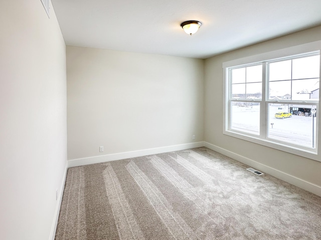 spare room with carpet flooring