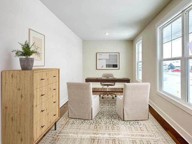 office space with a healthy amount of sunlight and light wood-type flooring