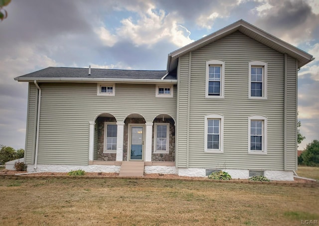 view of front of home with a front lawn