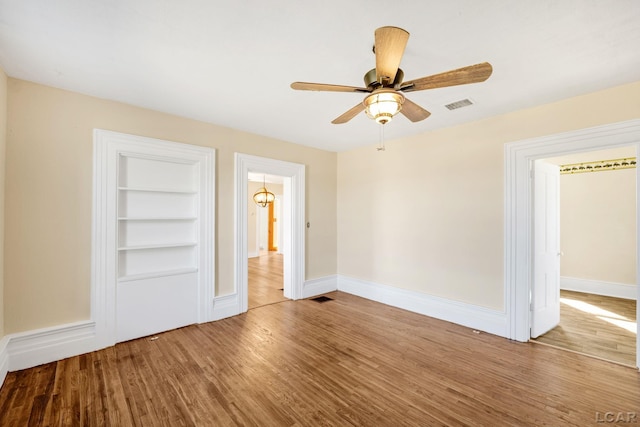 unfurnished bedroom with hardwood / wood-style flooring and ceiling fan