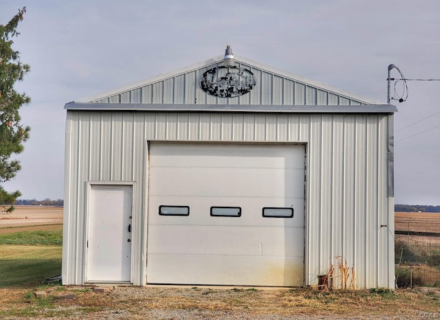 garage featuring a rural view