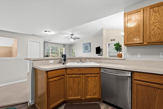 kitchen featuring ceiling fan, dishwasher, sink, dark hardwood / wood-style floors, and kitchen peninsula